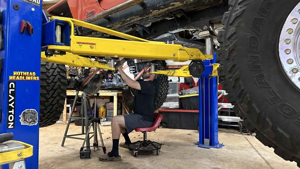 Starting to remove the old transmission from the Jeep